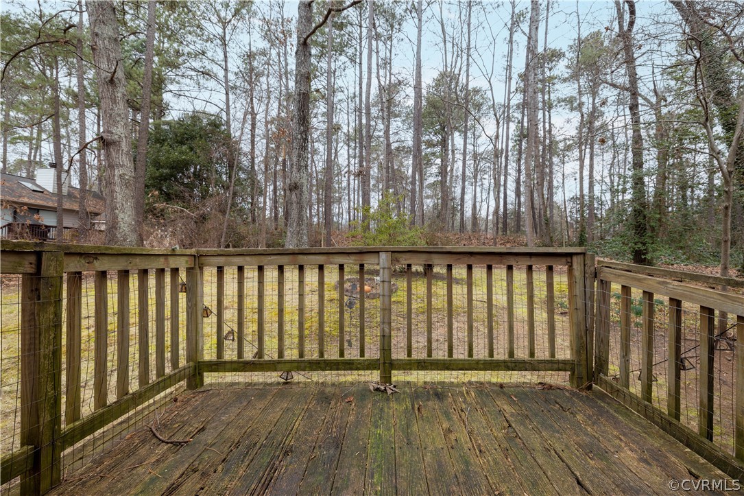 3102 Spreading Oak Road Midlothian, VA 23112 - Photo 24 of 25 a view of wooden balcony with trees