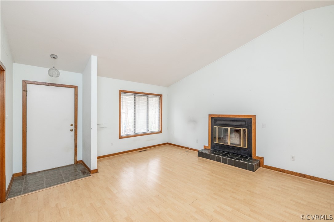 3102 Spreading Oak Road Midlothian, VA 23112 - Photo 3 of 25 an empty room with a fireplace and a window
