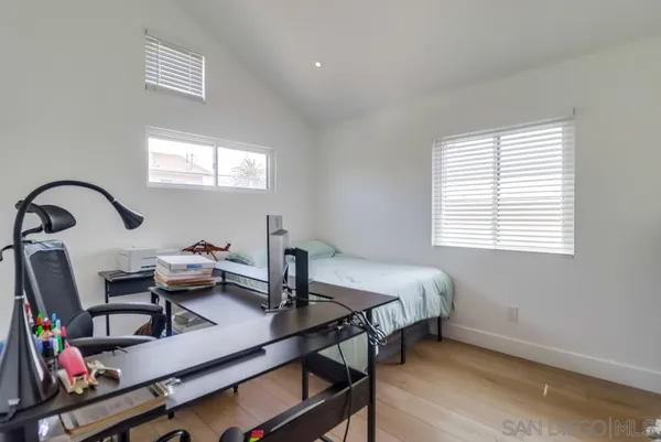 a bedroom with a bed and a table