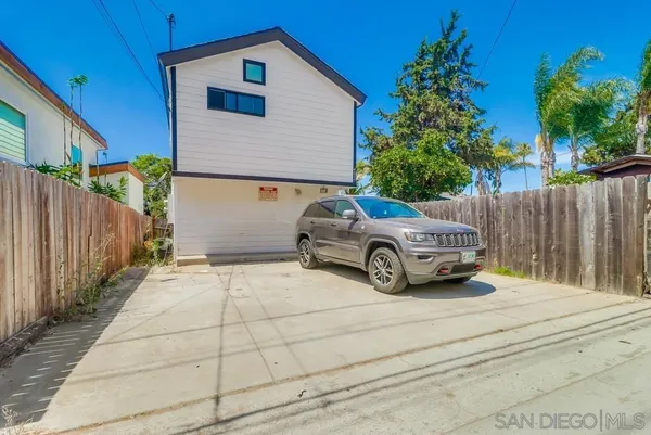 a car parked in front of a house