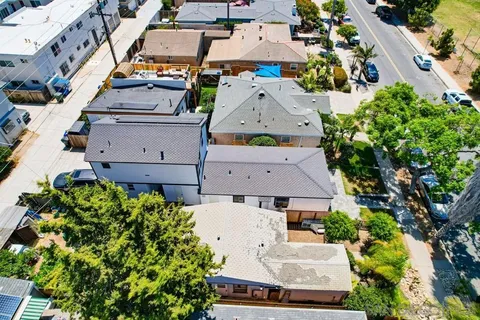 an aerial view of residential building and ocean