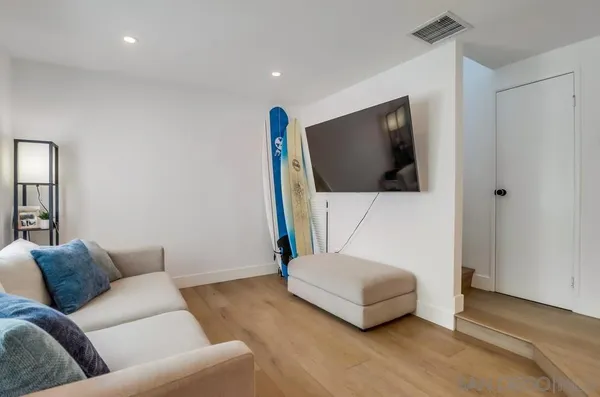 a living room with a couch and a flat screen tv