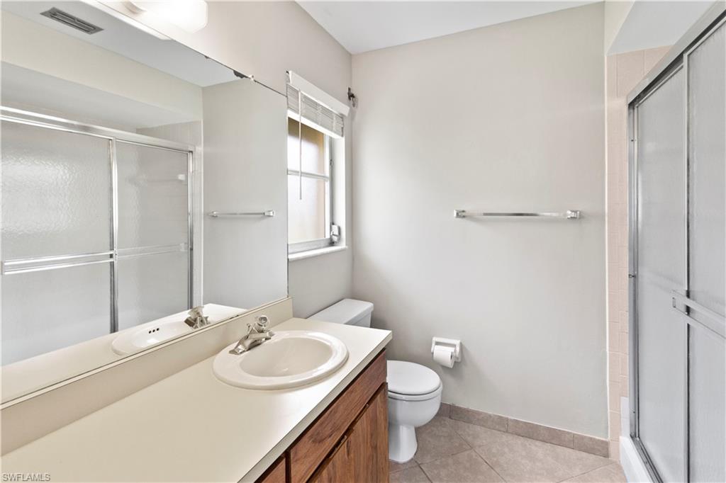 9081 Shaddock Road West Fort Myers, FL 33967 - Photo 12 of 23 a bathroom with a sink toilet and shower