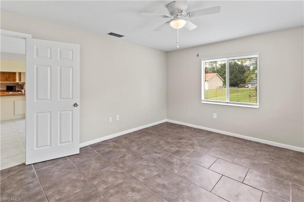 9081 Shaddock Road West Fort Myers, FL 33967 - Photo 13 of 23 a view of an empty room with a window