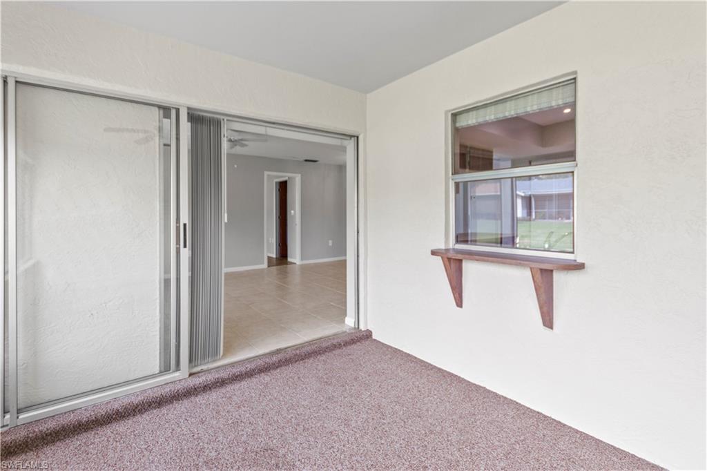 9081 Shaddock Road West Fort Myers, FL 33967 - Photo 20 of 23 a view of a small space with wooden floor and windows