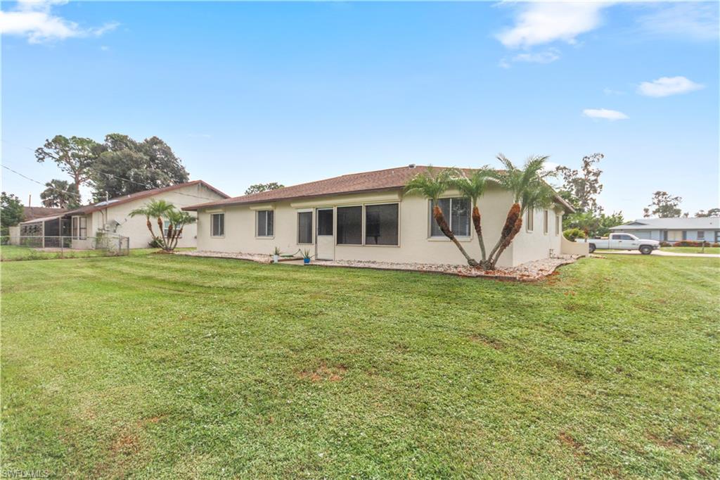 9081 Shaddock Road West Fort Myers, FL 33967 - Photo 21 of 23 a view of a house with a big yard
