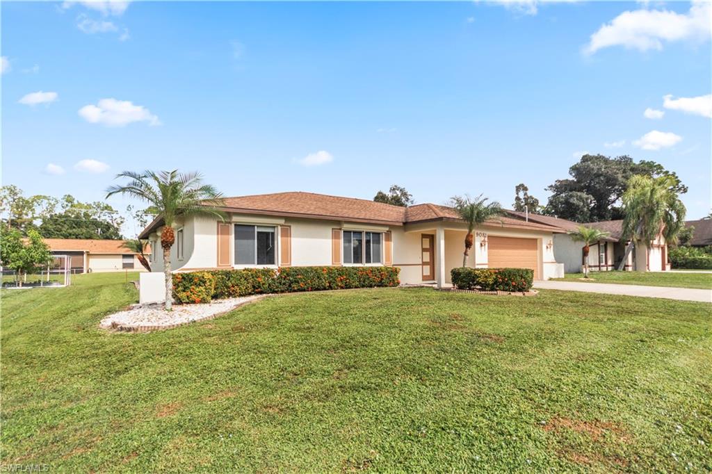 9081 Shaddock Road West Fort Myers, FL 33967 - Photo 23 of 23 a front view of a house with a yard