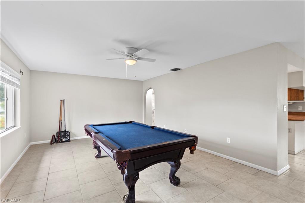 9081 Shaddock Road West Fort Myers, FL 33967 - Photo 3 of 23 a living room with a table