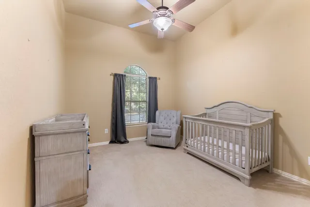 a bedroom with furniture and a window