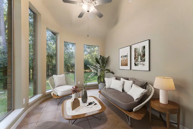 a living room with furniture and a lamp