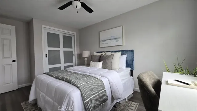 a bedroom with bed and window