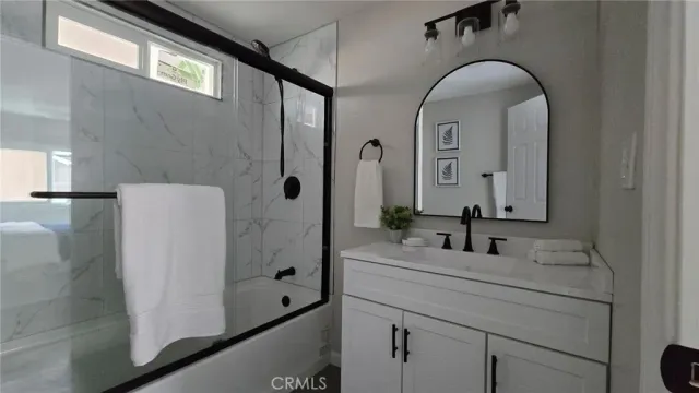 a bathroom with a sink and mirror