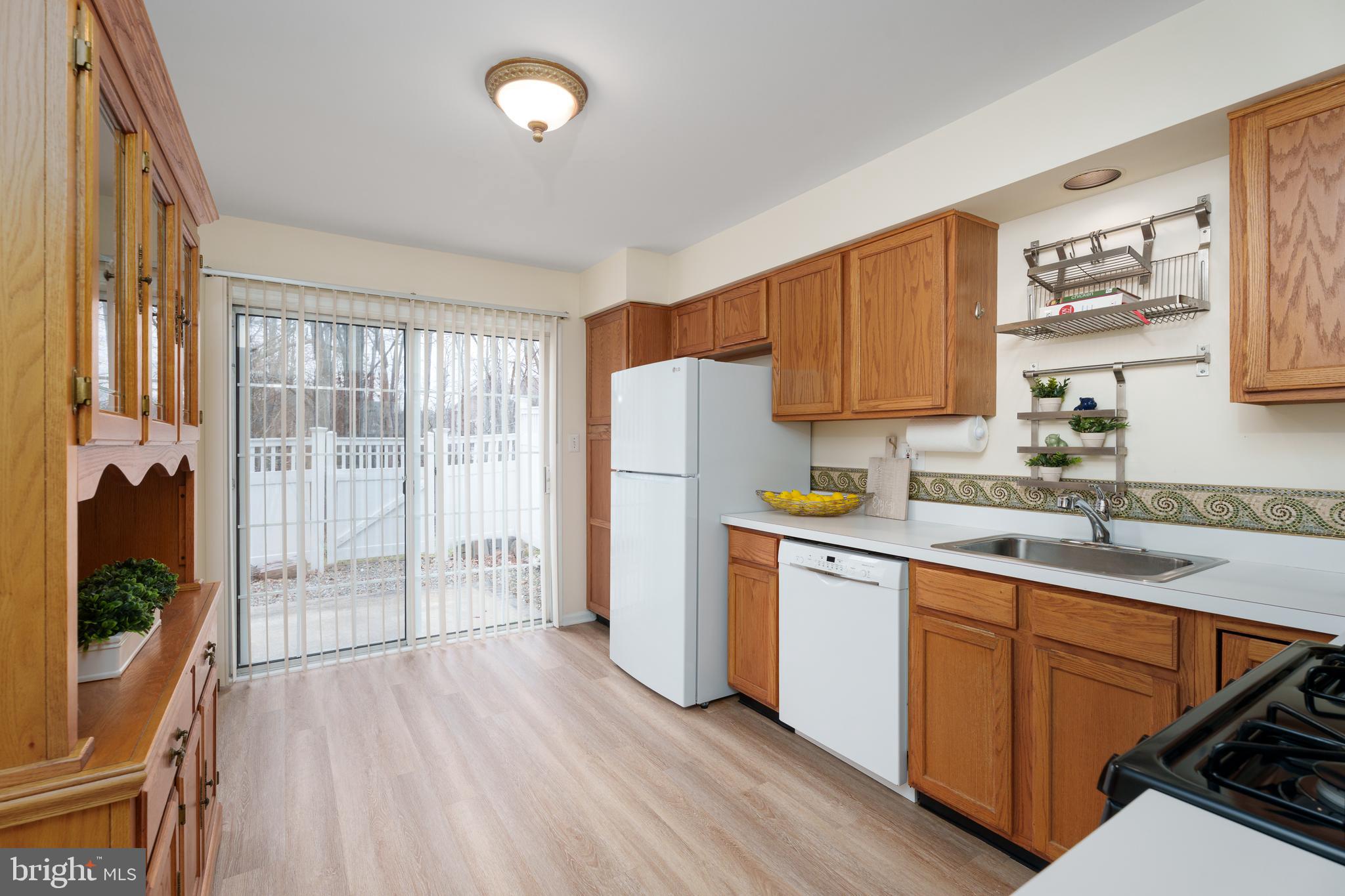 610 Bollen Court Pennington, NJ 08534 - Photo 12 of 30 a kitchen with a sink stove and refrigerator