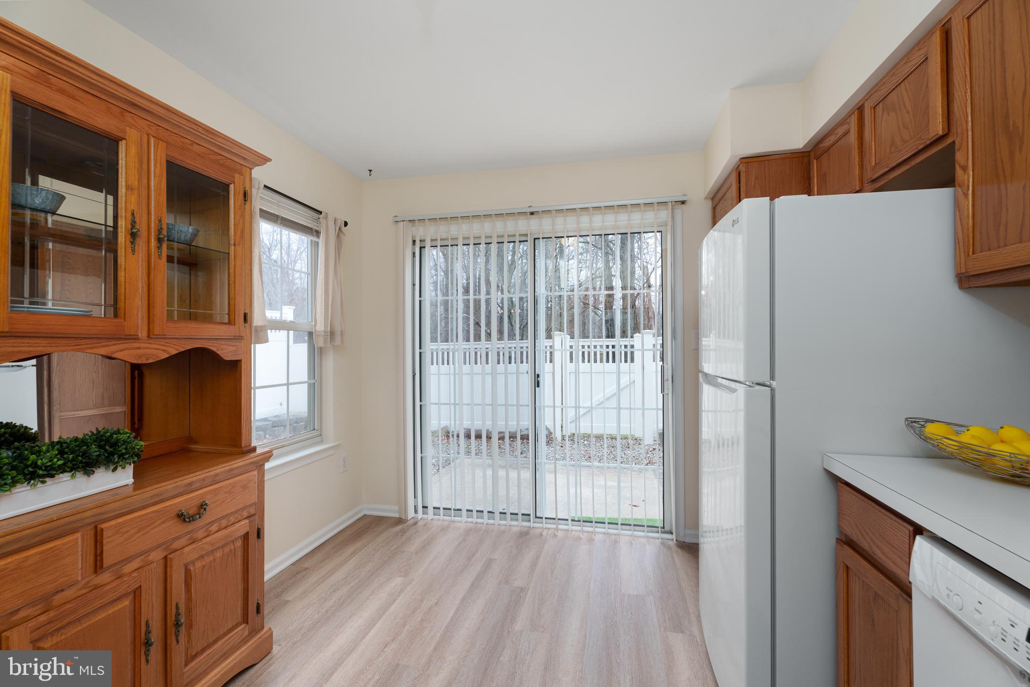 610 Bollen Court Pennington, NJ 08534 - Photo 14 of 30 a view of a kitchen with wooden floor and cabinets