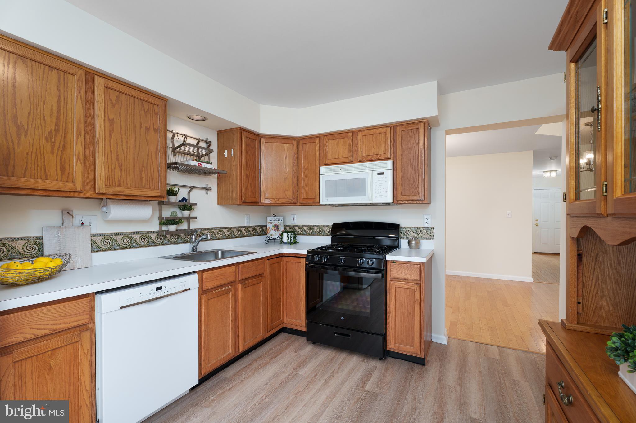 610 Bollen Court Pennington, NJ 08534 - Photo 15 of 30 a kitchen with stainless steel appliances granite countertop a stove a sink and a refrigerator