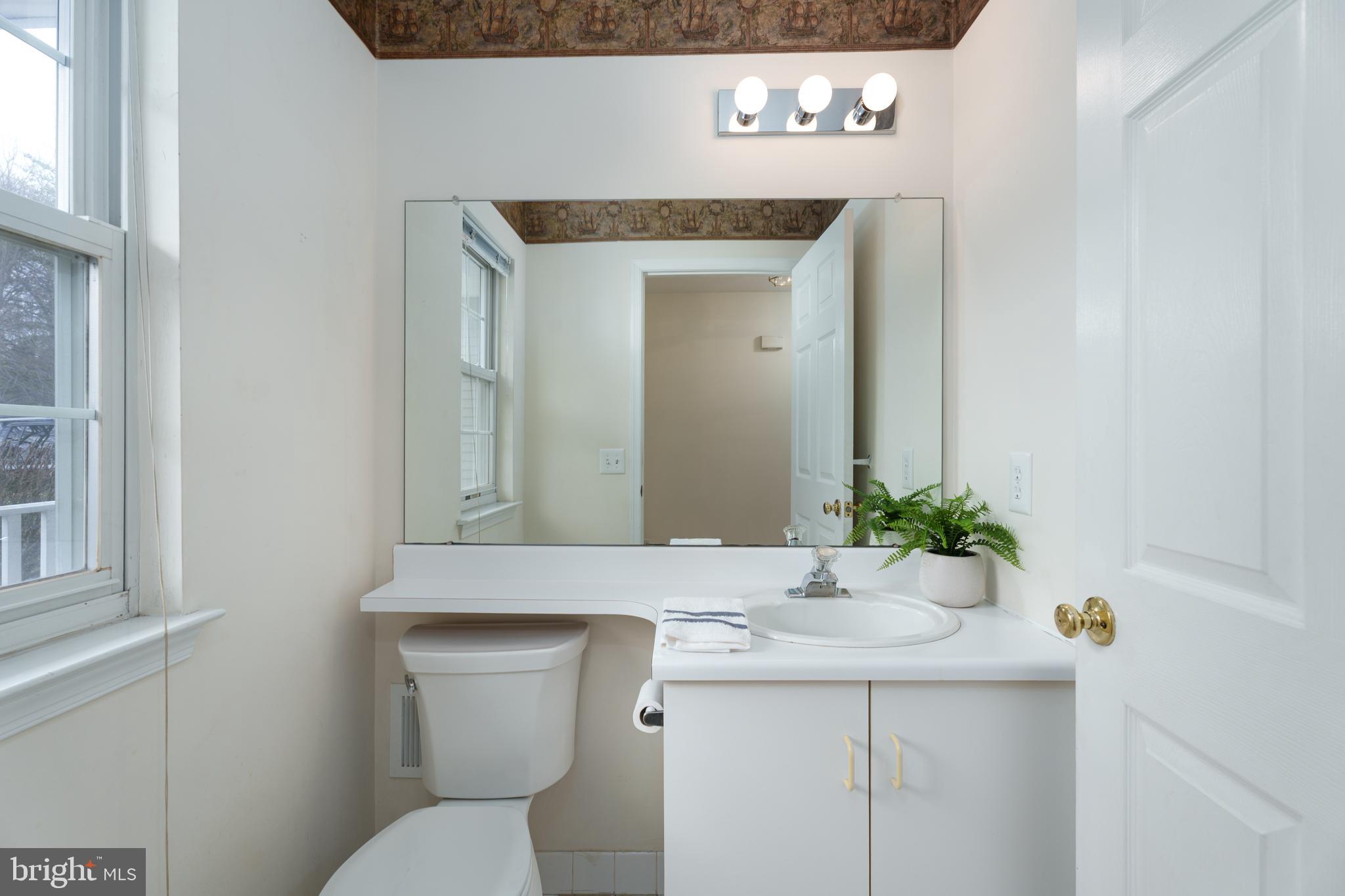610 Bollen Court Pennington, NJ 08534 - Photo 16 of 30 a bathroom with a toilet sink and mirror