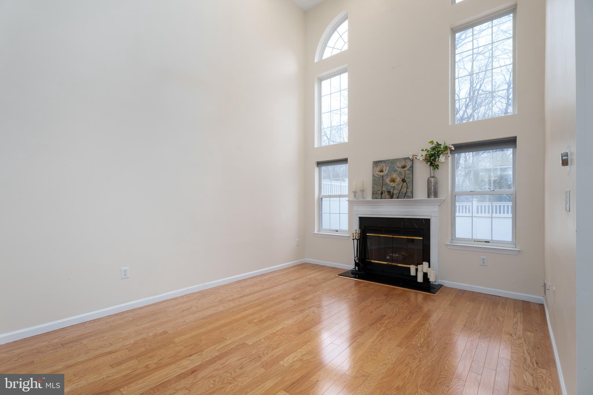 610 Bollen Court Pennington, NJ 08534 - Photo 7 of 30 an empty room with windows and fireplace