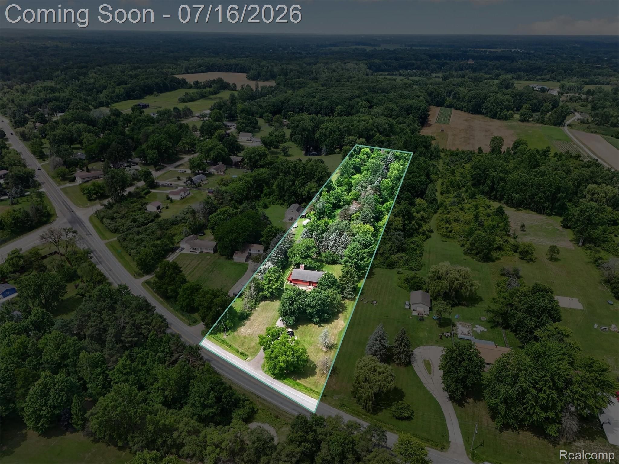 11210 Linden Road Linden, MI 48451 - Photo 27 of 61 Aerial perspective showcasing a property with extensive tree coverage and a long, linear lot outline