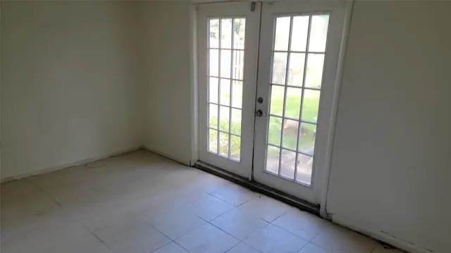 a view of an empty room and window