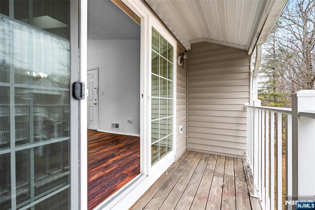556 Holly Court Mahwah, NJ 07430 - Photo 12 of 46 a view of balcony and wooden floor