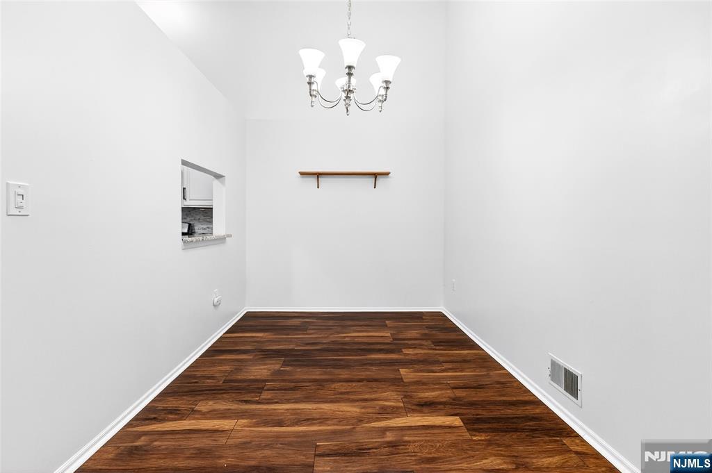 556 Holly Court Mahwah, NJ 07430 - Photo 13 of 46 a view of a hallway with a chandelier