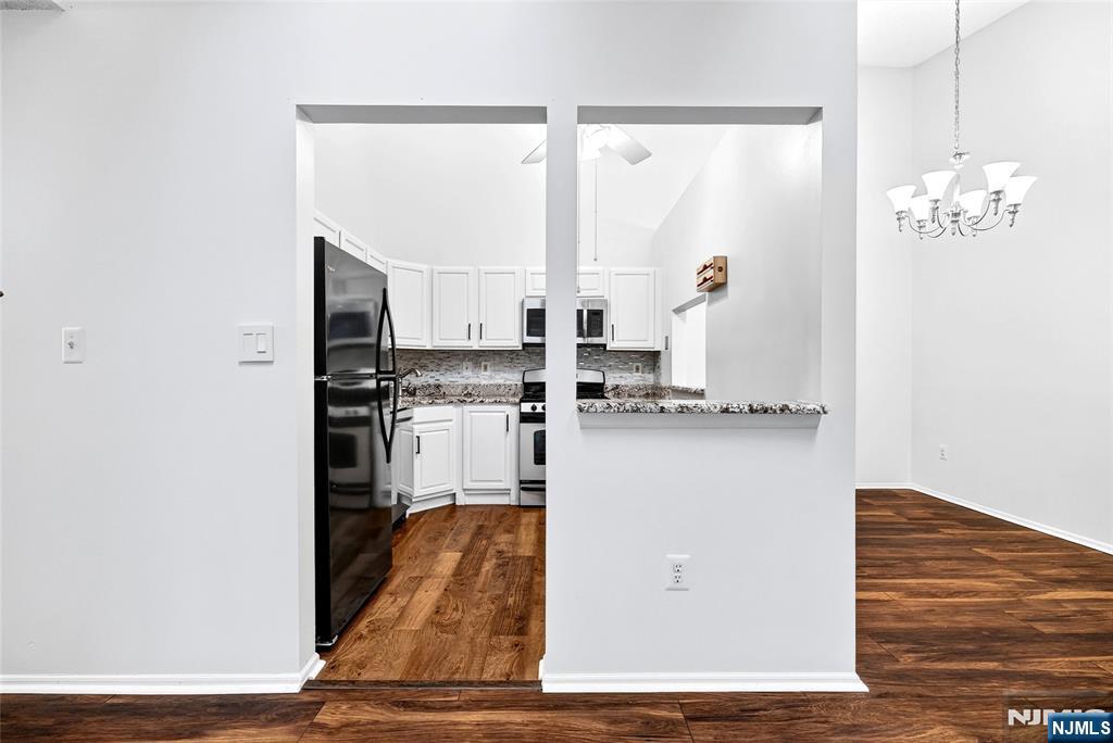 556 Holly Court Mahwah, NJ 07430 - Photo 15 of 46 a kitchen with stainless steel appliances a refrigerator and a microwave