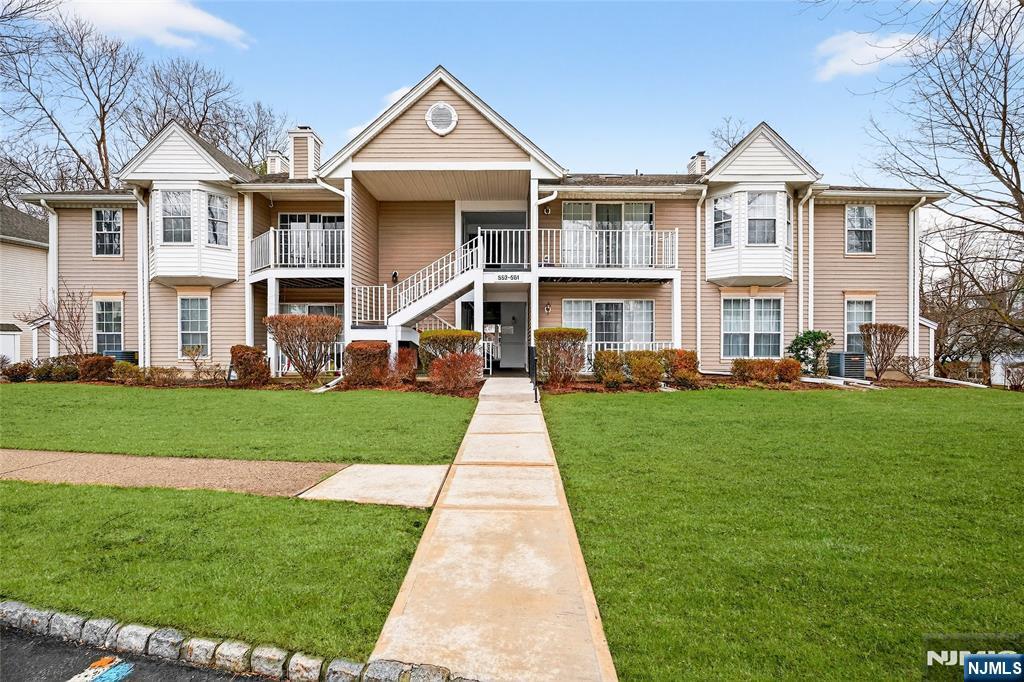 556 Holly Court Mahwah, NJ 07430 - Photo 2 of 46 a front view of a house with a yard