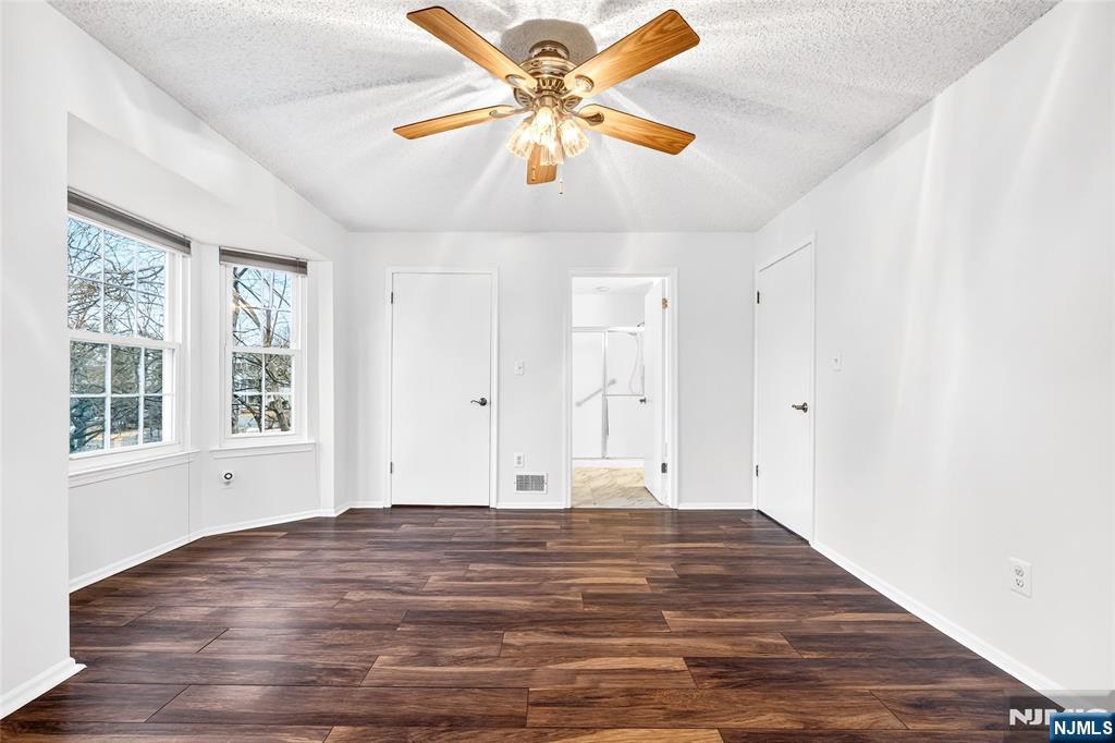 556 Holly Court Mahwah, NJ 07430 - Photo 22 of 46 a view of empty room with window and ceiling fan