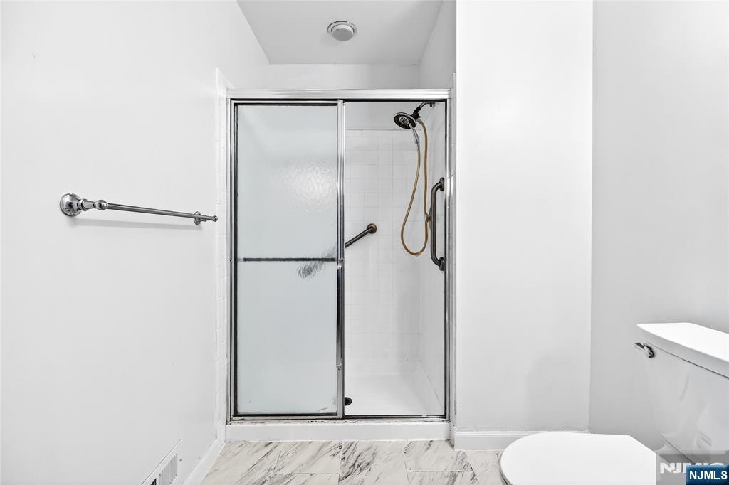 556 Holly Court Mahwah, NJ 07430 - Photo 29 of 46 a bathroom with a toilet and a shower