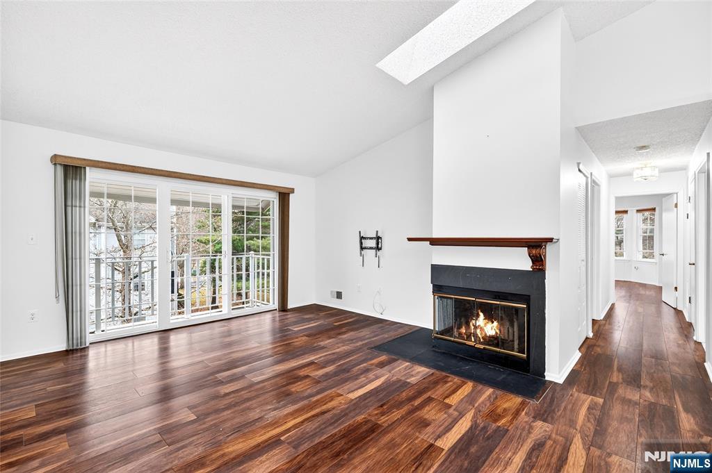 556 Holly Court Mahwah, NJ 07430 - Photo 3 of 46 a view of an empty room with wooden floor and a window