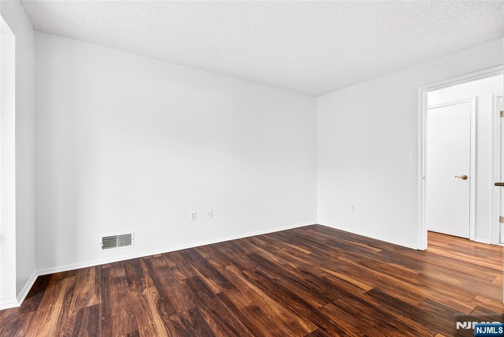 556 Holly Court Mahwah, NJ 07430 - Photo 35 of 46 a view of empty room with wooden floor