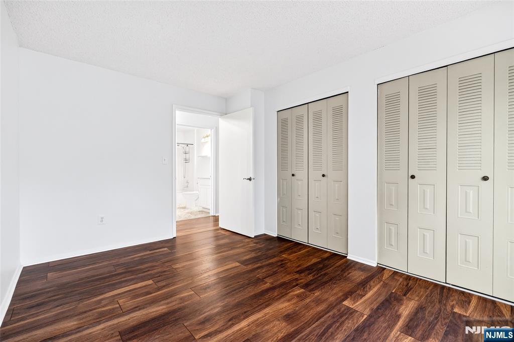 556 Holly Court Mahwah, NJ 07430 - Photo 36 of 46 a view of an empty room with wooden floor