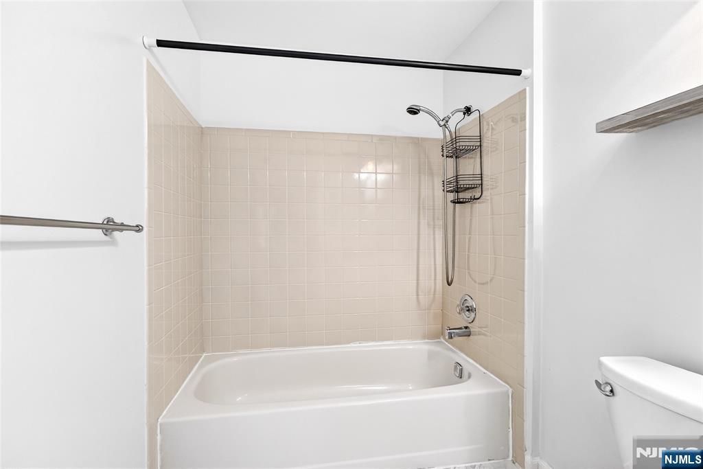 556 Holly Court Mahwah, NJ 07430 - Photo 38 of 46 a white bath tub sitting next to a shower