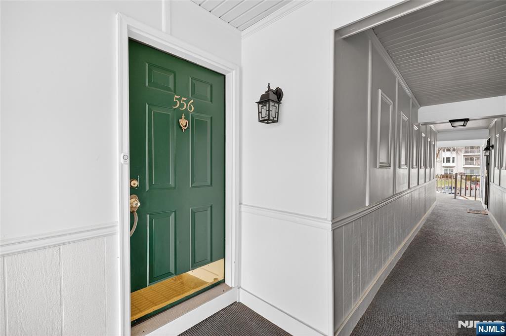 556 Holly Court Mahwah, NJ 07430 - Photo 45 of 46 a view of a hallway with wooden floor