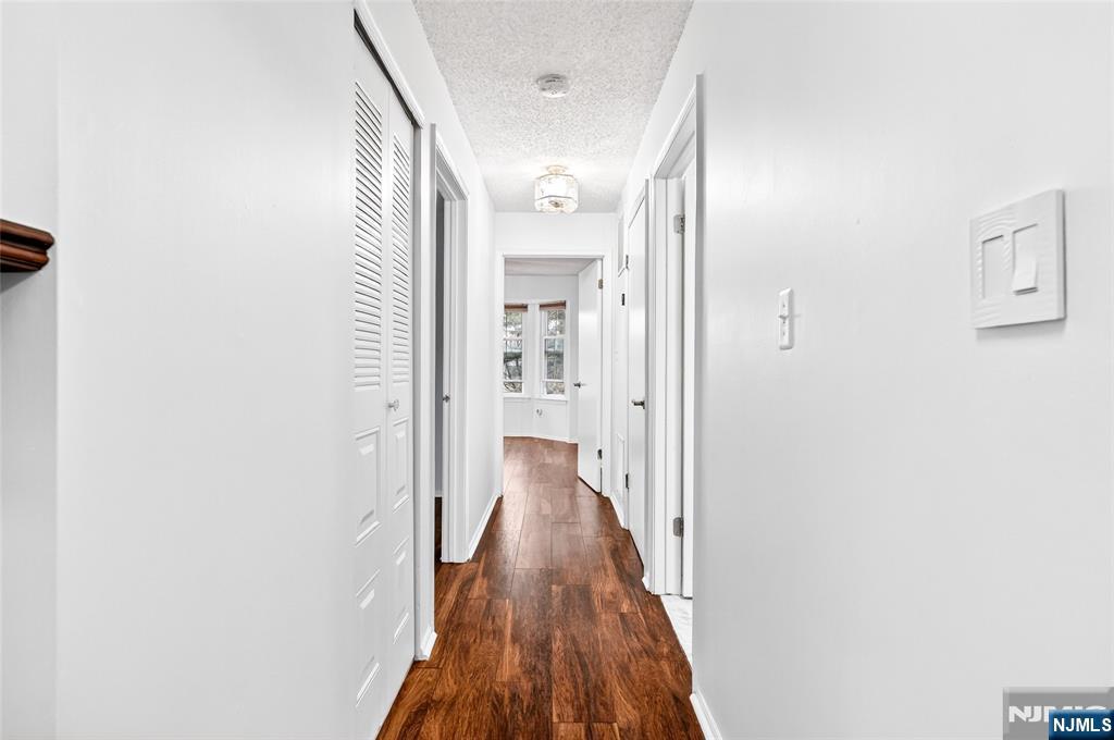 556 Holly Court Mahwah, NJ 07430 - Photo 46 of 46 a view of a hallway with wooden floor