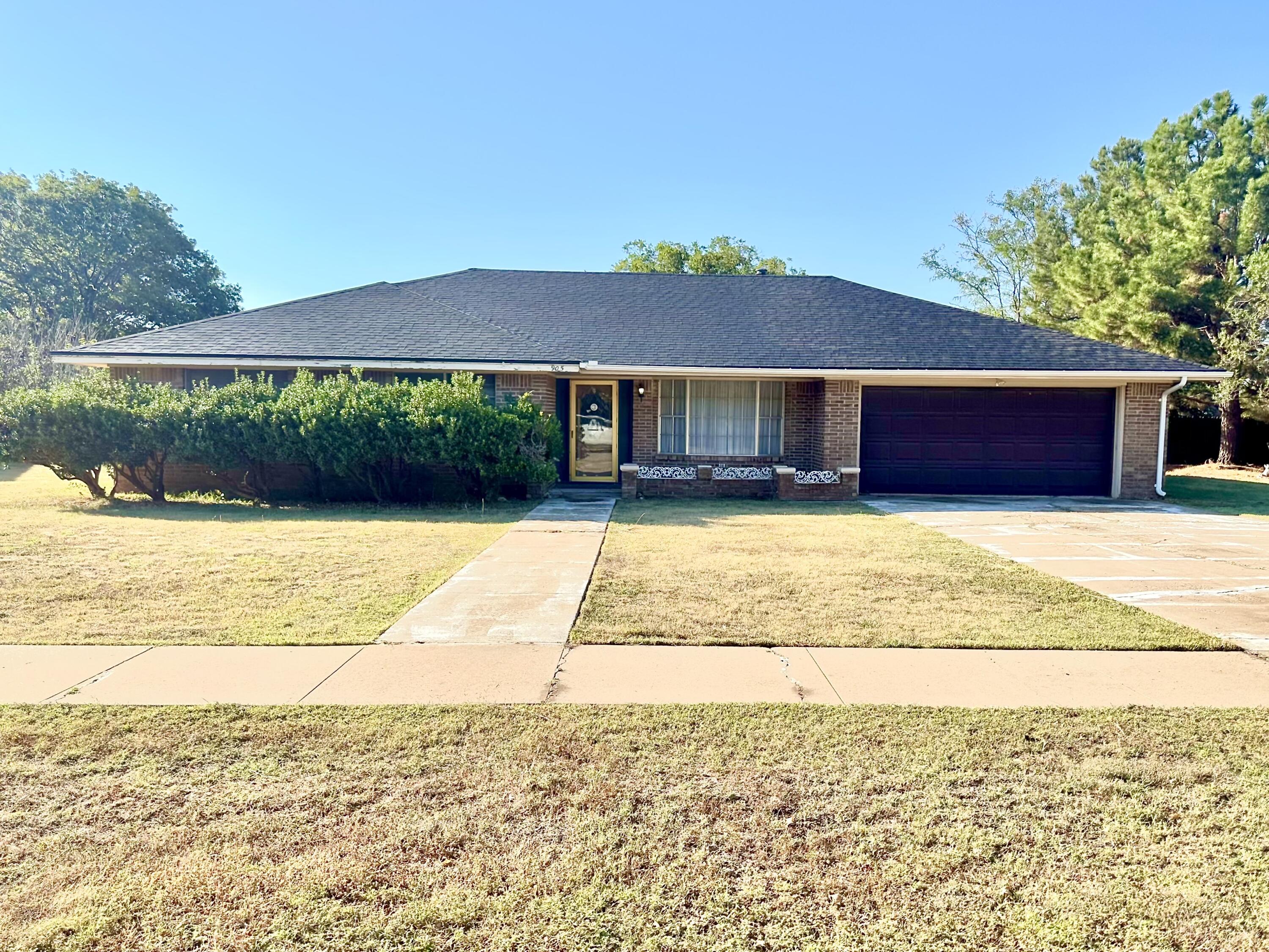 a view of house with yard and outdoor space