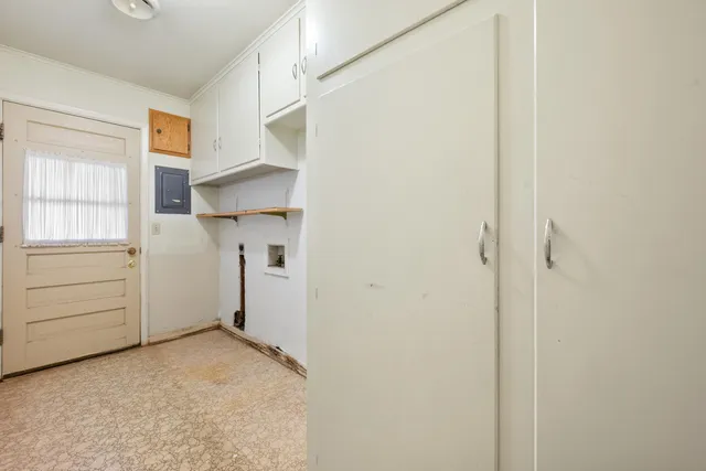 a view of a closet in kitchen