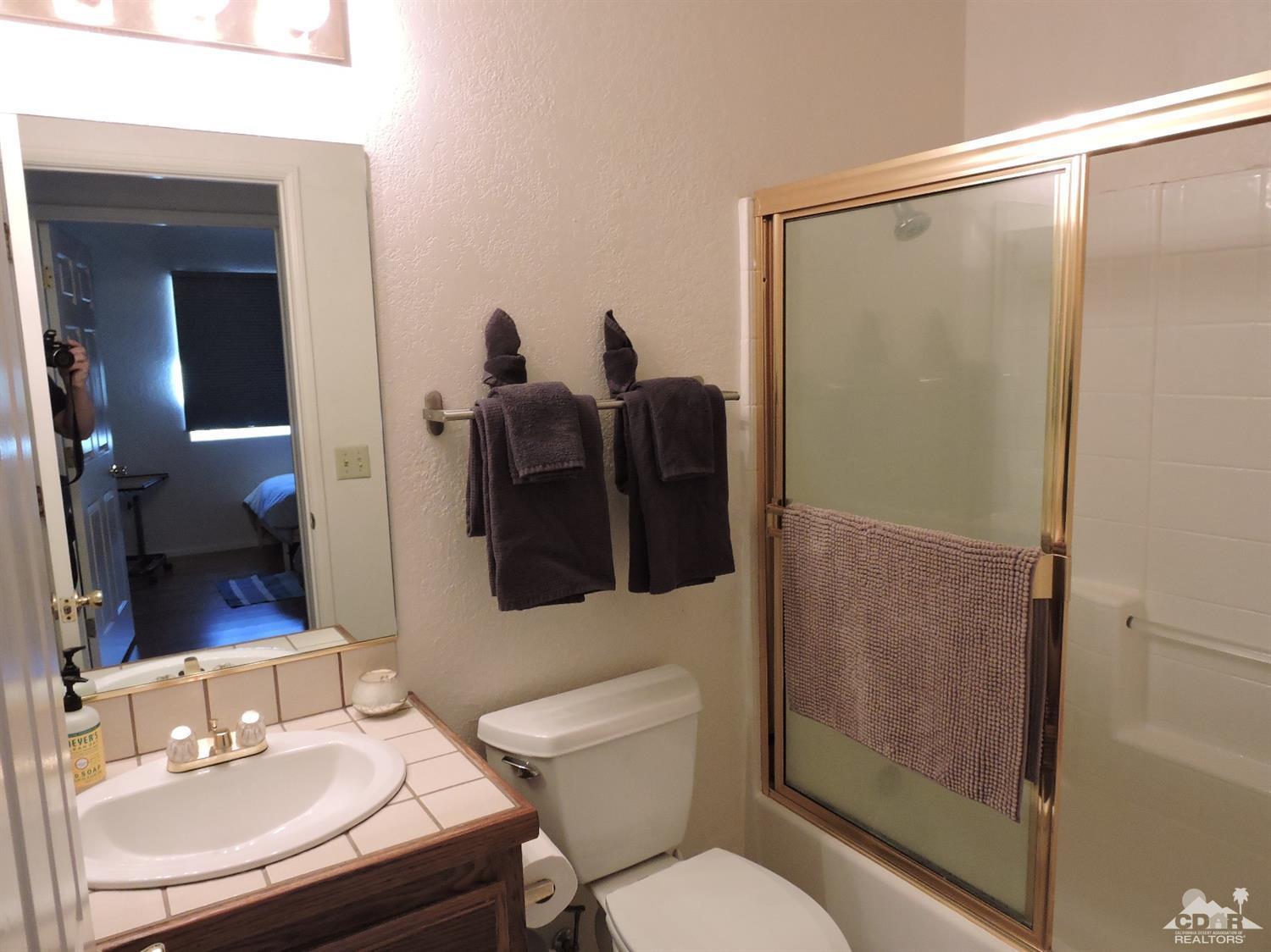 7369 Sunset Road Joshua Tree, CA 92252 - Photo 20 of 37 a bathroom with a sink toilet and shower