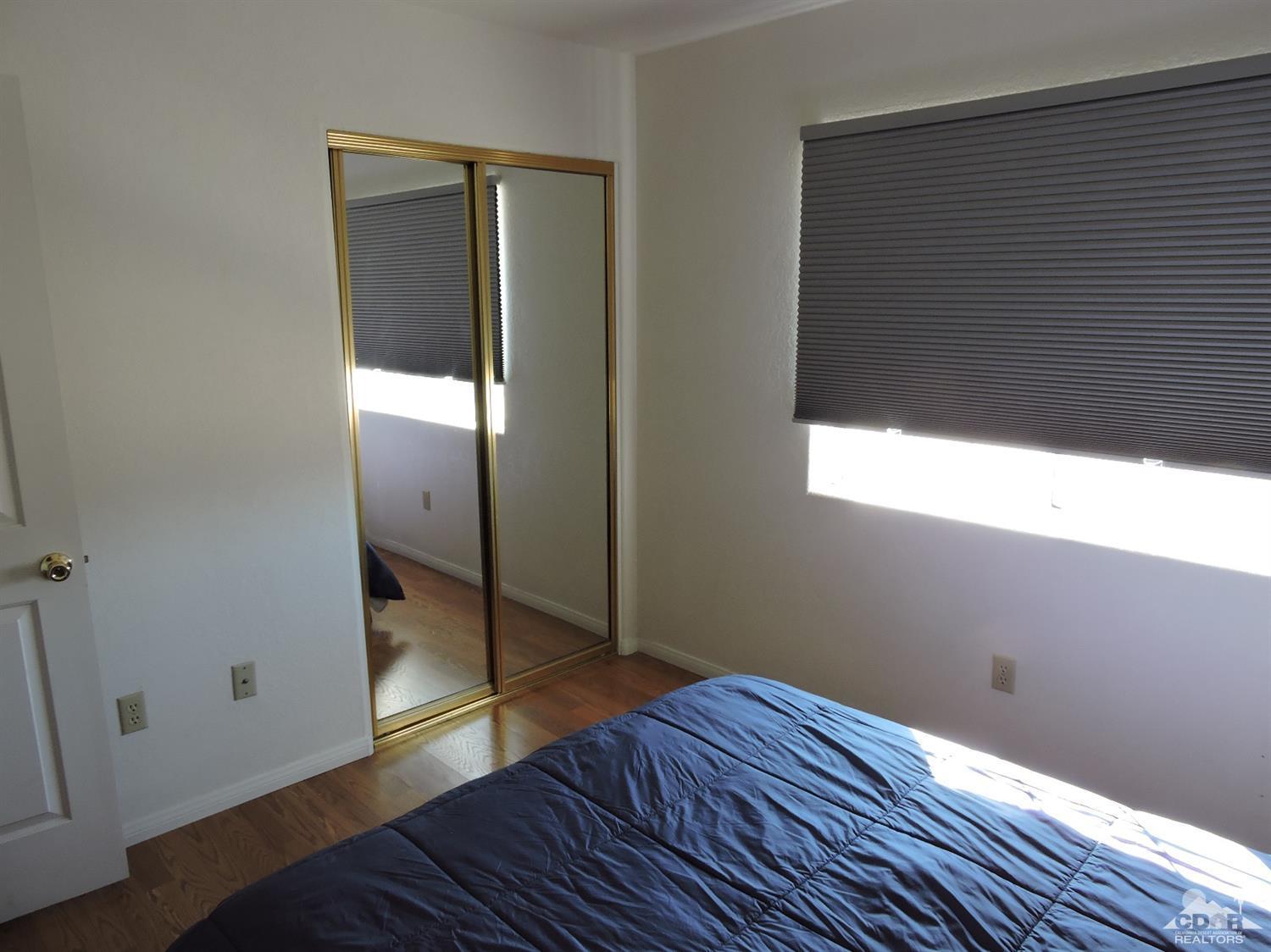 7369 Sunset Road Joshua Tree, CA 92252 - Photo 22 of 37 a view of empty room with wooden floor