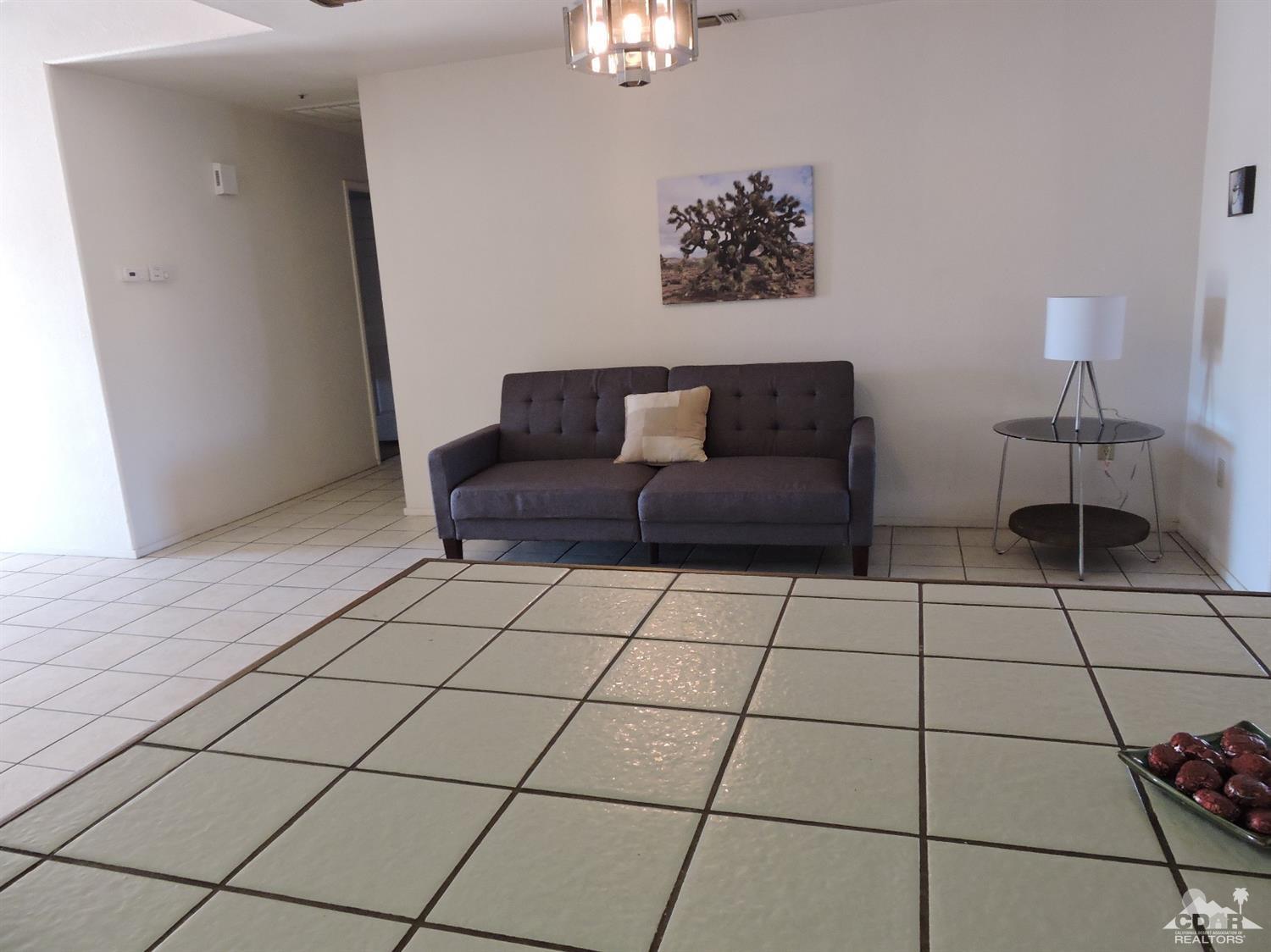7369 Sunset Road Joshua Tree, CA 92252 - Photo 25 of 37 a living room with furniture