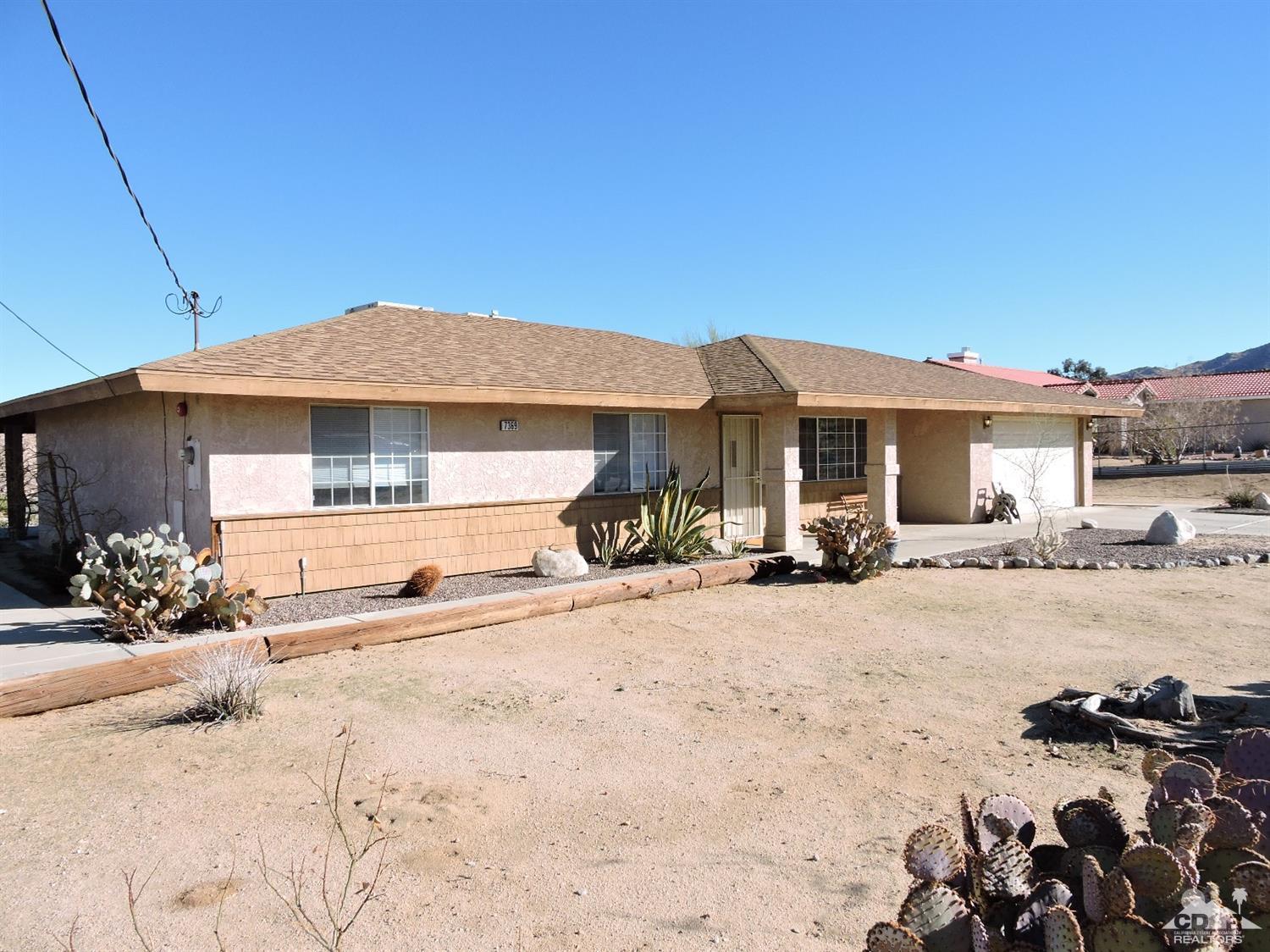 7369 Sunset Road Joshua Tree, CA 92252 - Photo 36 of 37 a front view of a house with a yard
