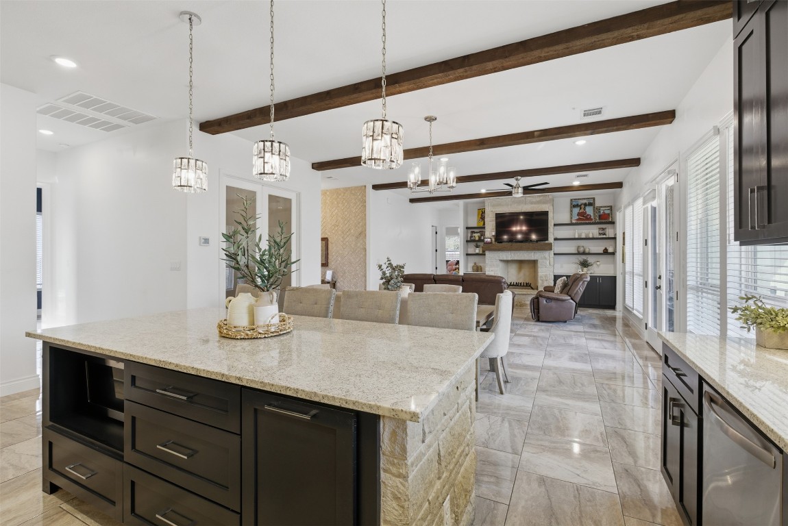 1905 South College Street Georgetown, TX 78626 - Photo 14 of 37 a kitchen with granite countertop a sink and a refrigerator
