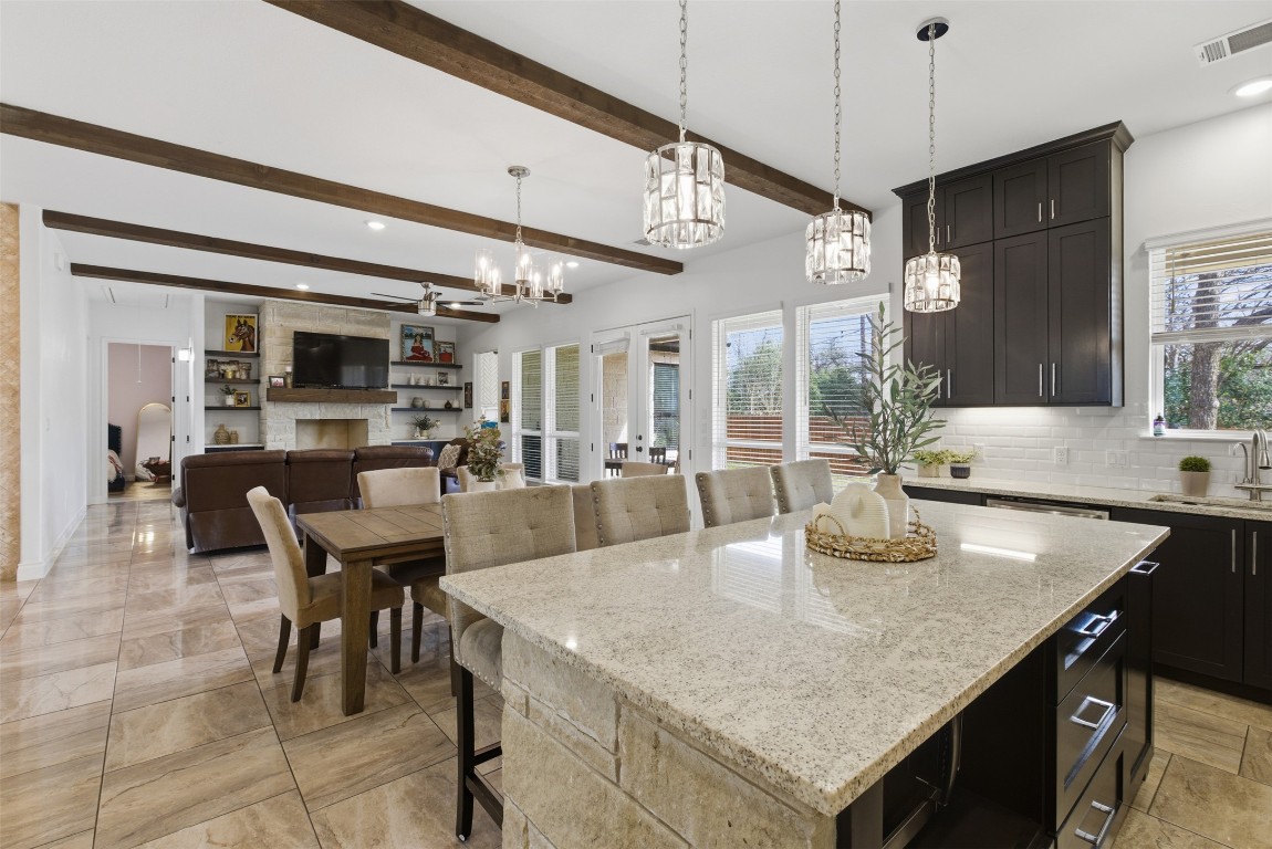 1905 South College Street Georgetown, TX 78626 - Photo 36 of 37 a kitchen with a table chairs and microwave