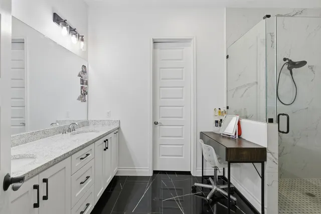 a bed room with a bed and a chair