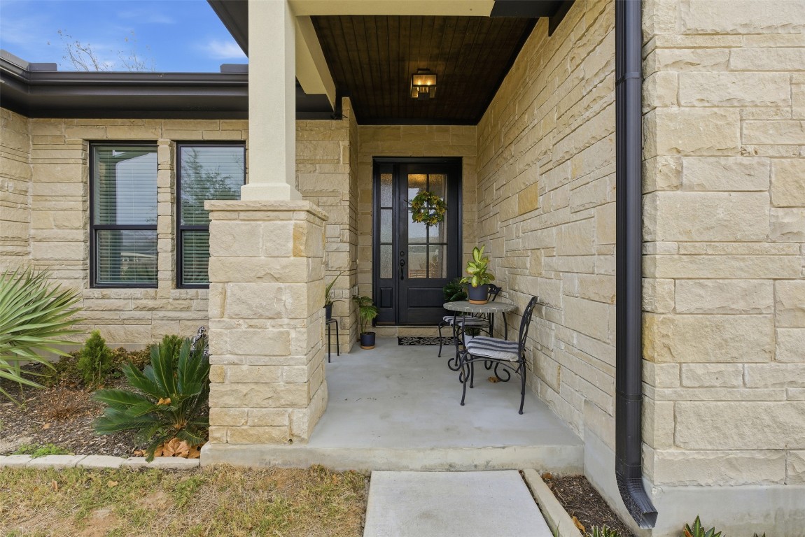 1905 South College Street Georgetown, TX 78626 - Photo 2 of 37 a view of a patio with table and chairs and potted plants