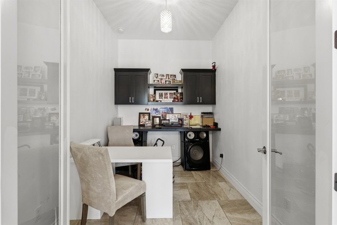 1905 South College Street Georgetown, TX 78626 - Photo 24 of 37 a kitchen with a sink cabinets and stainless steel appliances