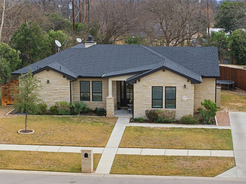 1905 South College Street Georgetown, TX 78626 - Photo 3 of 37 a front view of a house with garden