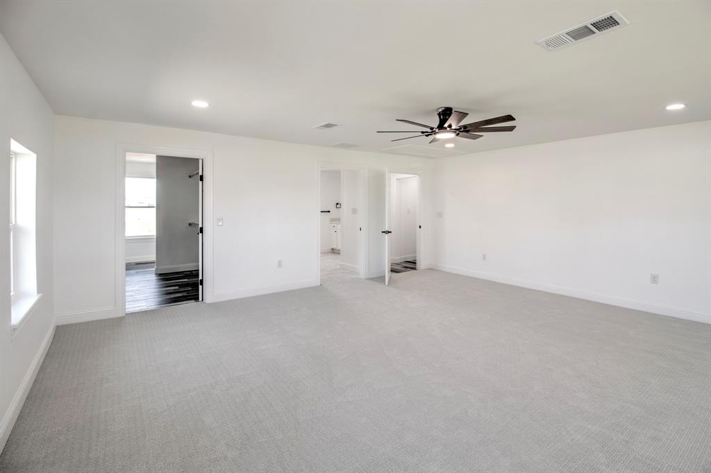 3884 Lois Road East Sanger, TX 76266 - Photo 30 of 40 an empty room with fan and windows
