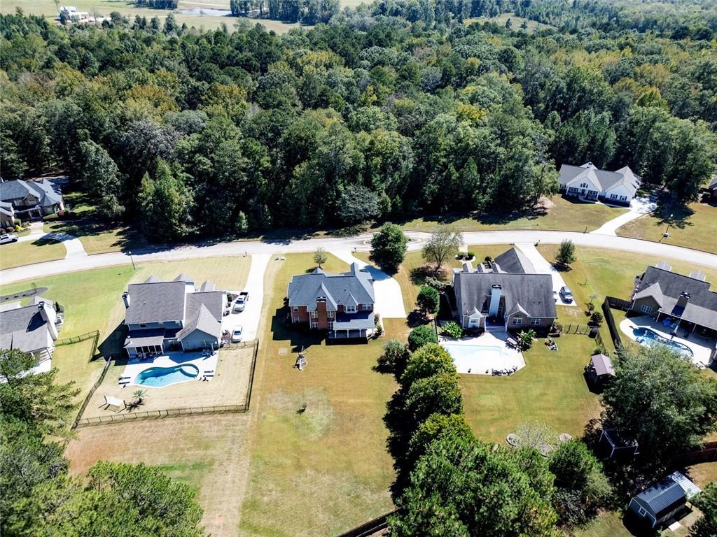 150 Alcovy Reserve Way Covington, GA 30014 - Photo 11 of 70 an aerial view of a house with yard swimming pool and outdoor seating
