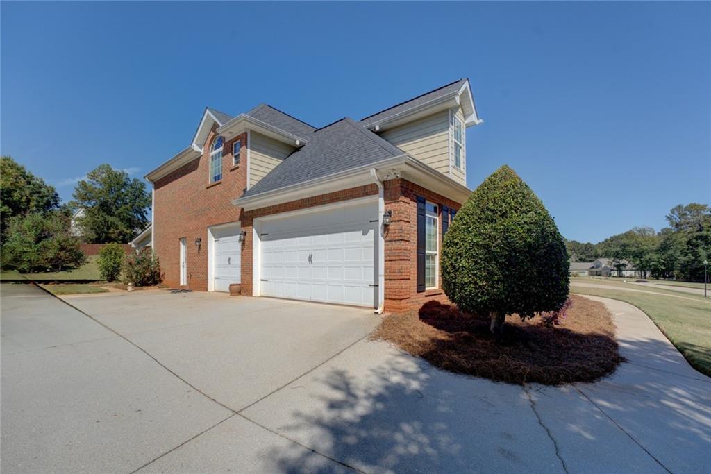 150 Alcovy Reserve Way Covington, GA 30014 - Photo 13 of 70 a view of a house with yard and garage